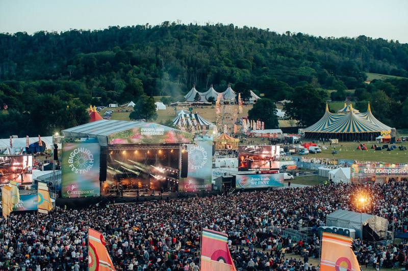 Daytime view across the Big Church Festival 2025 site, with the main stage, screens and a large crowd